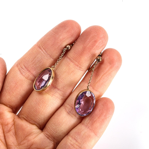 107 - A pair of amethyst drop earrings, gilt-metal settings with oval mixed-cut amethysts, amethysts measu... 