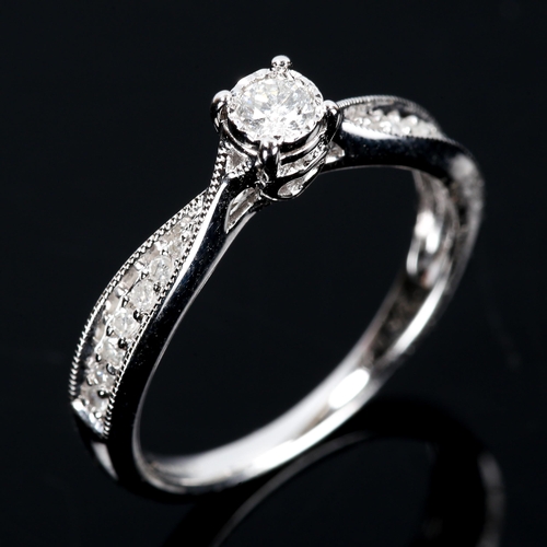 108 - A modern 9ct white gold solitaire diamond ring, set with modern round brilliant-cut diamond and sing... 