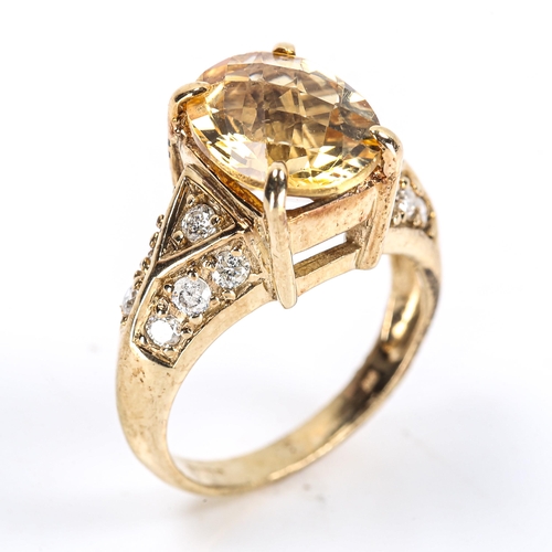 109 - A modern 9ct gold citrine and diamond dress ring, set with oval rose-cut citrine and modern round br... 