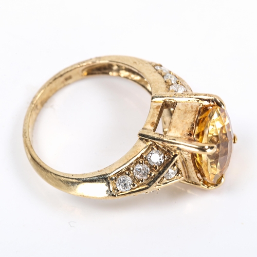 109 - A modern 9ct gold citrine and diamond dress ring, set with oval rose-cut citrine and modern round br... 