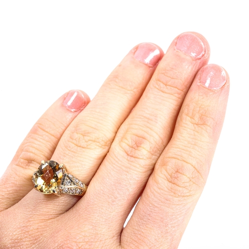 109 - A modern 9ct gold citrine and diamond dress ring, set with oval rose-cut citrine and modern round br... 