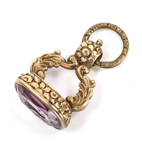 111 - A 19th century amethyst seal fob, unmarked yellow metal chased floral settings with cornucopia desig... 