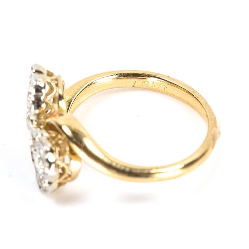 114 - An 18ct gold diamond double flowerhead crossover ring, set with old European and single-cut diamonds... 