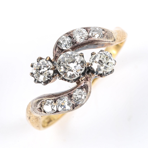 119 - An early 20th century 18ct gold 3-stone diamond crossover ring, set with old and old European-cut di... 