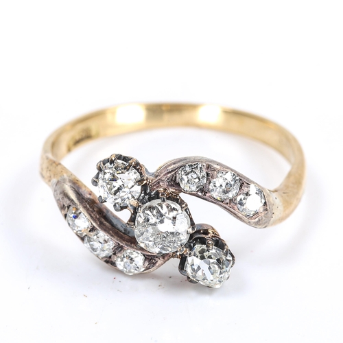 119 - An early 20th century 18ct gold 3-stone diamond crossover ring, set with old and old European-cut di... 