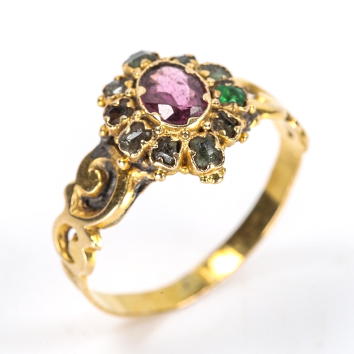 122 - A Victorian ruby and emerald cluster dress ring, pierced foliate shoulders with engraved shank, 12mm... 