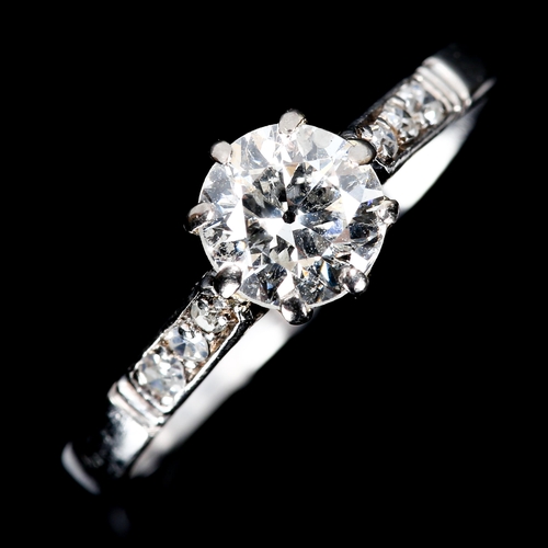 124 - An Antique platinum 0.6ct solitaire diamond ring, claw set with round brilliant diamond and single-c... 