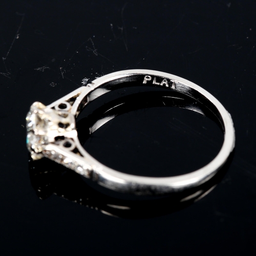 124 - An Antique platinum 0.6ct solitaire diamond ring, claw set with round brilliant diamond and single-c... 