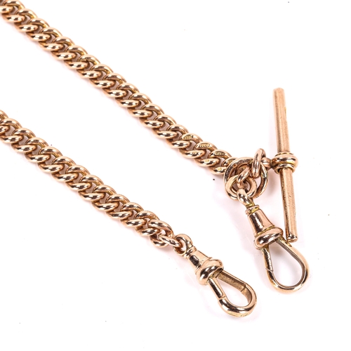 125 - An early 20th century 9ct rose gold Albert chain necklace, curb links with sliding T-bar and 2 dog c... 