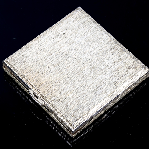 126 - An Elizabeth II square silver compact, allover bark effect design, by Kigu Ltd, hallmarks London 197... 