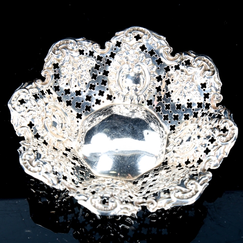 132 - A late Victorian silver bon bon dish, relief embossed and foliate decoration, by James Deakin & Sons... 