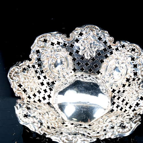 132 - A late Victorian silver bon bon dish, relief embossed and foliate decoration, by James Deakin & Sons... 