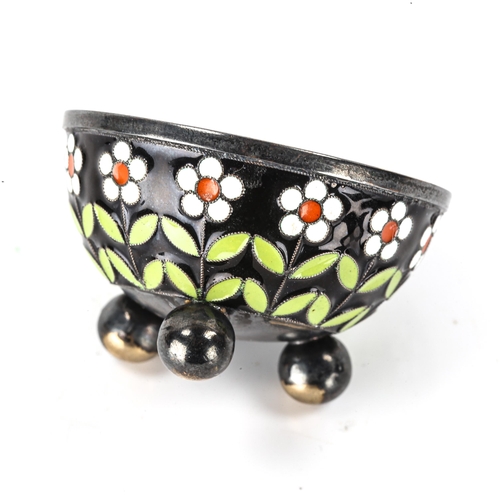 135 - A Russian silver and champleve enamel salt cellar, daisy flower decoration on 3 bun feet, marks on b... 