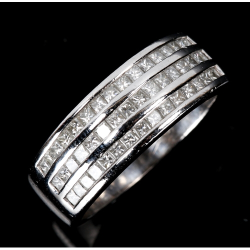 147 - A modern 18ct white gold Princess diamond band ring, set with 3 rows of diamonds, total diamond cont... 