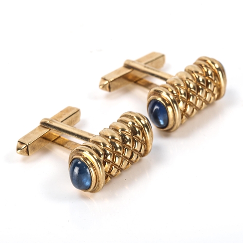 152 - A modern pair of 9ct gold sapphire cufflinks, engraved lattice decoration with cabochon sapphire ter... 