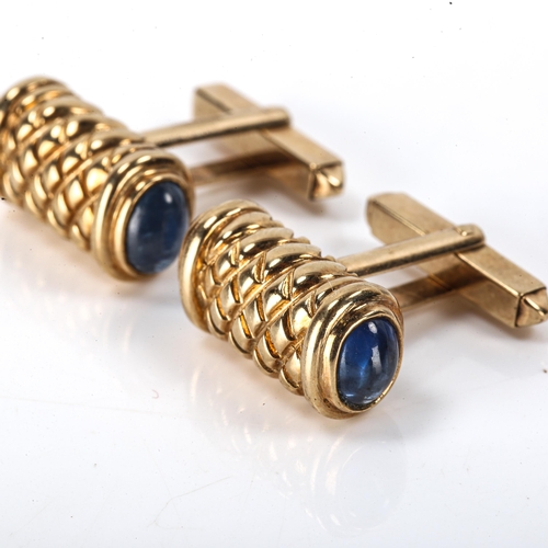 152 - A modern pair of 9ct gold sapphire cufflinks, engraved lattice decoration with cabochon sapphire ter... 