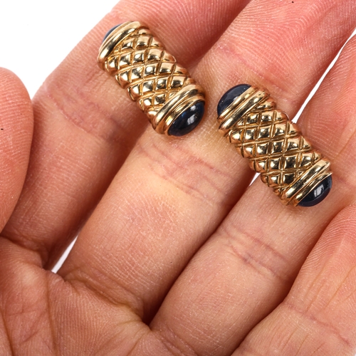 152 - A modern pair of 9ct gold sapphire cufflinks, engraved lattice decoration with cabochon sapphire ter... 