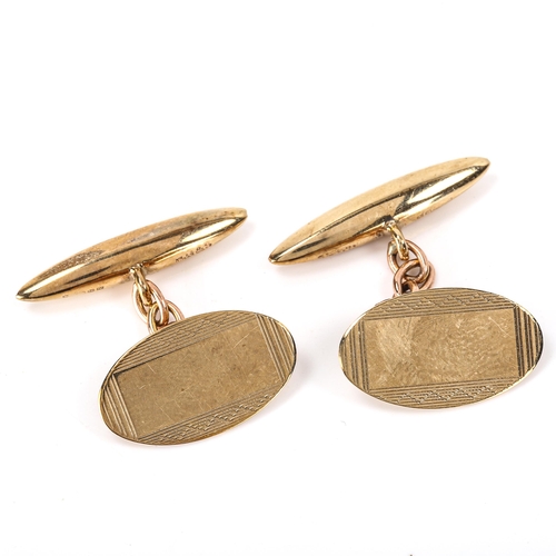 156 - A pair of late 20th century 9ct gold oval cufflinks, engine turned decoration with bullet backings, ... 