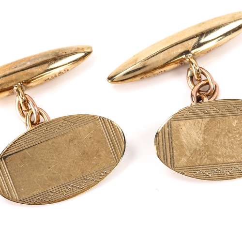 156 - A pair of late 20th century 9ct gold oval cufflinks, engine turned decoration with bullet backings, ... 