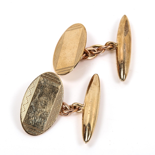 156 - A pair of late 20th century 9ct gold oval cufflinks, engine turned decoration with bullet backings, ... 