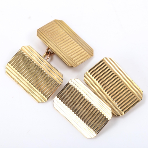 159 - A pair of late 20th century 9ct gold cufflinks, canted rectangular form with fluted decoration, indi... 