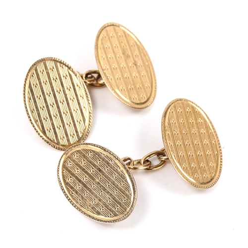 162 - A pair of early 20th century 9ct gold oval cufflinks, engine turned decoration, maker's marks LAP, h... 