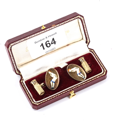 164 - A pair of late 20th century silver-gilt gentleman's novelty cufflinks, with enamel nude lady and sho... 