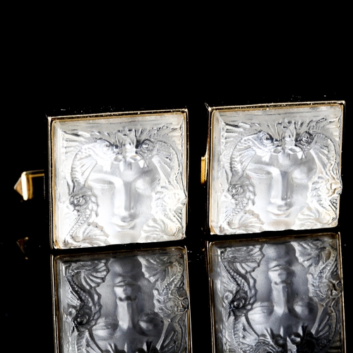 166 - LALIQUE - a pair of gold plated and frosted glass Masque de Femme pattern cufflinks, panel length 15... 