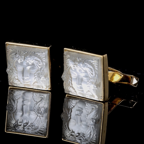 166 - LALIQUE - a pair of gold plated and frosted glass Masque de Femme pattern cufflinks, panel length 15... 