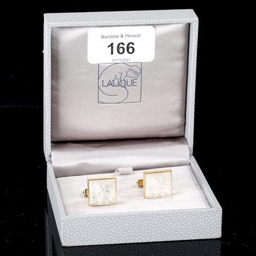 166 - LALIQUE - a pair of gold plated and frosted glass Masque de Femme pattern cufflinks, panel length 15... 