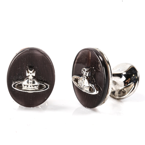 167 - VIVIENNE WESTWOOD - a pair of modern black mother-of-pearl Orb cufflinks, chrome plated settings, pa... 