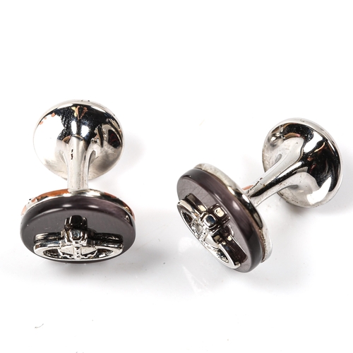 167 - VIVIENNE WESTWOOD - a pair of modern black mother-of-pearl Orb cufflinks, chrome plated settings, pa... 