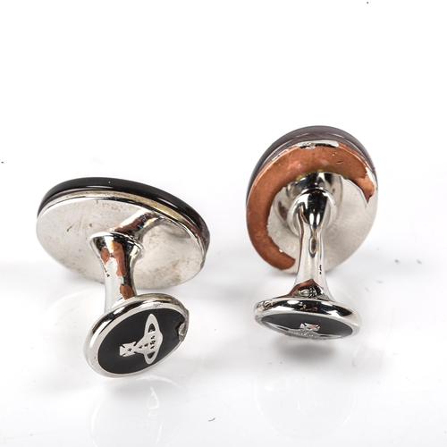 167 - VIVIENNE WESTWOOD - a pair of modern black mother-of-pearl Orb cufflinks, chrome plated settings, pa... 