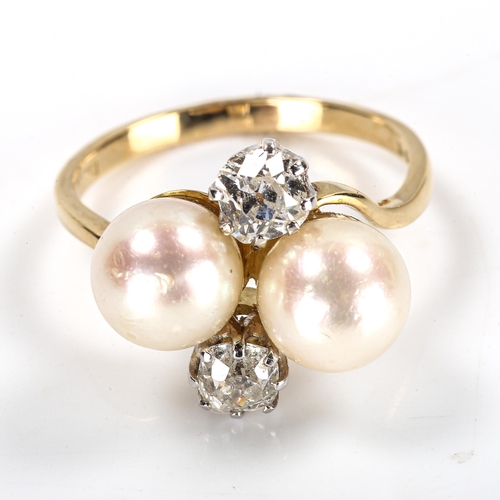 60 - A late 20th century 18ct gold pearl and diamond crossover ring, set with old-cut diamonds, total dia... 