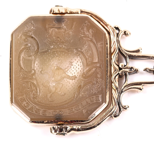 64 - A fine 19th century swivel hardstone armorial seal fob, side 1 depicting crest with rampant lion ben... 