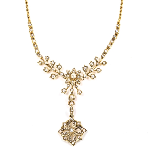 66 - An Edwardian 15ct gold pearl and diamond necklace, floral design set with split pearls and diamond s... 