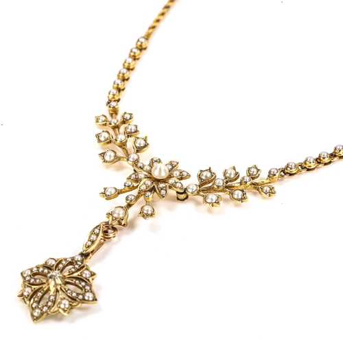 66 - An Edwardian 15ct gold pearl and diamond necklace, floral design set with split pearls and diamond s... 