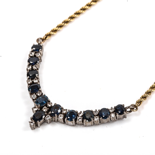 72 - A 9ct gold and silver blue and white sapphire necklace, on rope twist chain, necklace length 42cm, 1... 