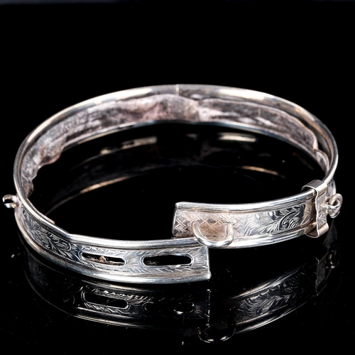 75 - A Victorian silver cat collar, engraved floral decoration with leather lining and inscribed name Wea... 