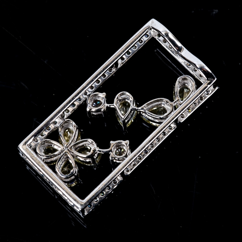 83 - A modern 18ct white gold fancy yellow diamond and diamond pendant, rectangular form with openwork fl... 