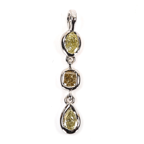 88 - A modern 18ct white gold fancy yellow diamond line pendant, bezel set with vari-cut diamonds, total ... 