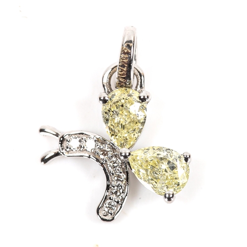 90 - A modern 18ct white gold fancy yellow diamond and diamond figural butterfly pendant, set with pear b... 