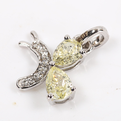 90 - A modern 18ct white gold fancy yellow diamond and diamond figural butterfly pendant, set with pear b... 