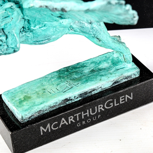 1001 - MARK CORETH - verdigris patinated bronze sculpture, winged lion, signed, on McArthurGlen granite bas... 