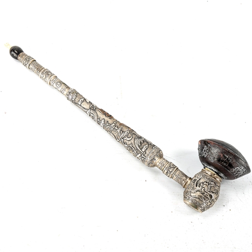 1012 - A Chinese unmarked white metal opium pipe with terracotta bowl, relief decorated dragon decoration, ... 