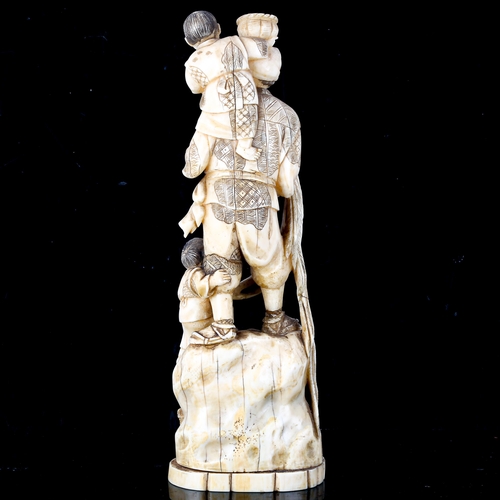 1019 - A Japanese ivory okimono, depicting a farmer with children poultry and baskets of grapes, Meiji Peri... 