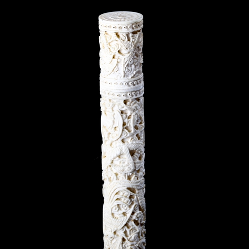 1025 - A 19th century Chinese ivory cylindrical needle case, with relief carved dragon and exotic bird deco... 