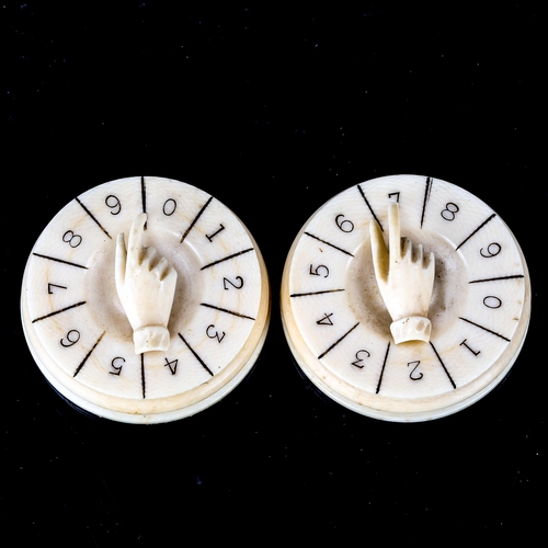 1027 - A pair of 19th century ivory drum-shaped Bridge markers, with hand design mounts, diameter 4.5cm