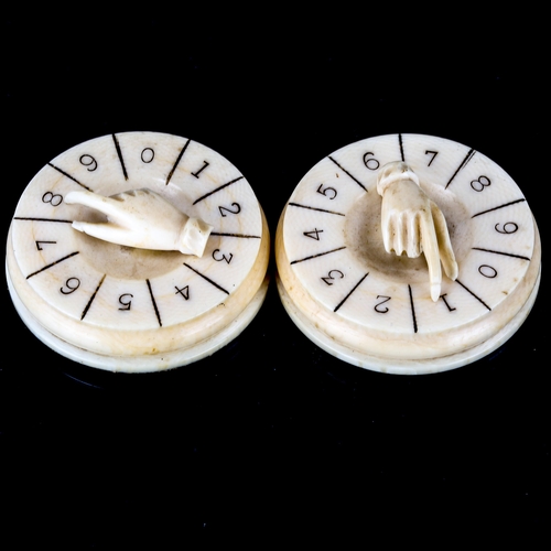 1027 - A pair of 19th century ivory drum-shaped Bridge markers, with hand design mounts, diameter 4.5cm