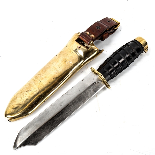 1034 - A Russian Navy diver's knife, with steel blade, rubber handle and brass fittings, original heavy sol... 